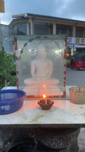 Everyday street life and Buddhist shrine observed in Ahangama