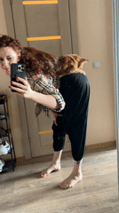 Woman in plaid shirt observed at Saint Petersburg residence