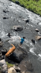 River day in Klungkung — kids, adults, and a golden retriever