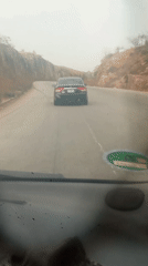 Motorist records drive through rocky terrain near Panshanu, Nigeria