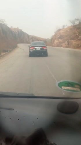 Motorist records drive through rocky terrain near Panshanu, Nigeria