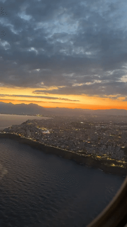 Family departure flight from Antalya Airport captures sunset rainbow