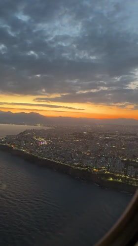 Family departure flight from Antalya Airport captures sunset rainbow