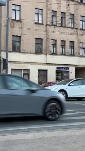 Evening street life in central Riga, trams and all