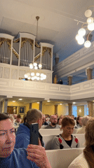 Woman sings from church balcony in Saint Petersburg service