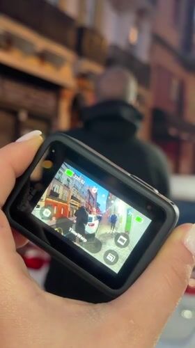 Person films Madrid streets with GoPro in TimeWarp mode