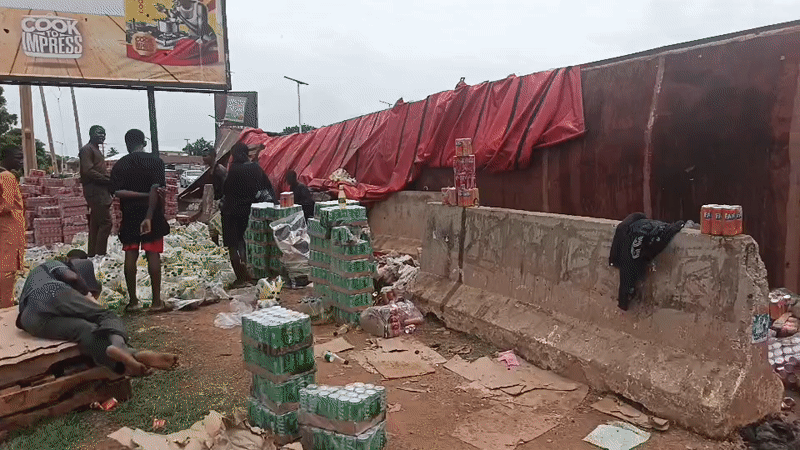 Commercial truck overturns in Jos, Nigeria, spilling cargo