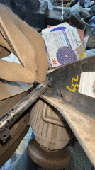 Person repairs plastic component with tool in Минино, Russia