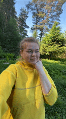 Woman in yellow jacket enjoys quiet morning in Chaikovsky