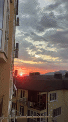 Woman documents evening routine and dramatic sunset in Sochi