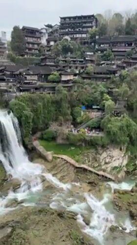 Tourist visits documented at Furong Ancient Town waterfall, China