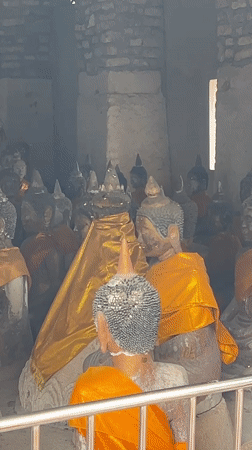 Prayers and offerings at a Ko Samui Buddhist-Hindu temple