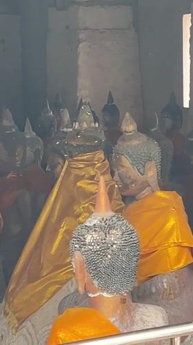 Prayers and offerings at a Ko Samui Buddhist-Hindu temple