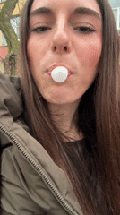 Woman spits out white object, grimaces in Plovdiv