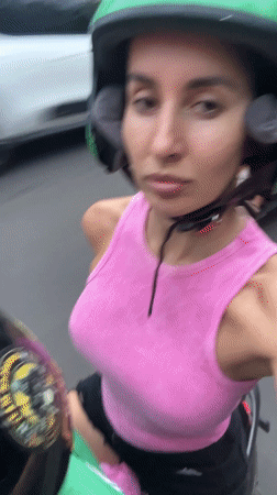 Scooter selfie and playful kitten captured in Kuta Selatan