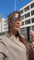 Woman photographed in patterned blazer on Russian city street