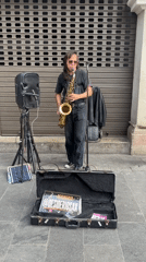 Saxophone player performing on the streets of Lima