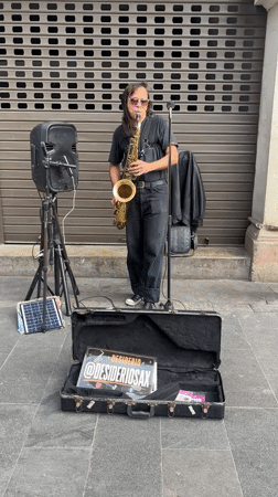 Saxophone player performing on the streets of Lima