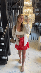 Woman Takes Selfies Near Staircase in Moscow Interior