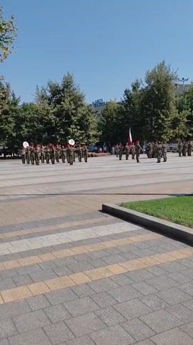 Military band marches through Pleven plaza on summer morning