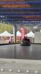 Man uses smartphone while sitting in bumper car in Plovdiv