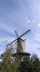 Tourist documents afternoon stroll through historic Alkmaar, Netherlands