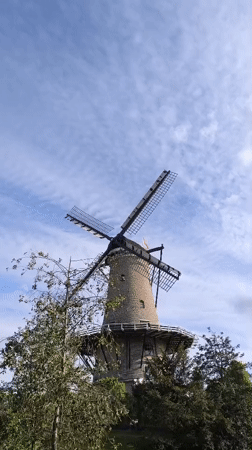 Tourist documents afternoon stroll through historic Alkmaar, Netherlands