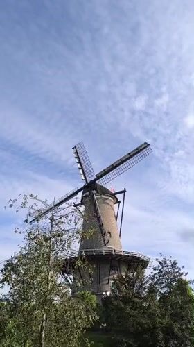 Tourist documents afternoon stroll through historic Alkmaar, Netherlands