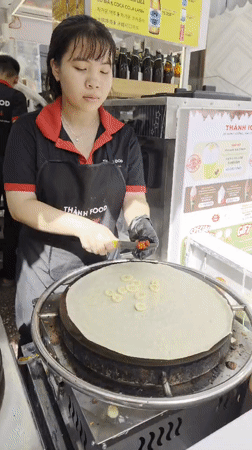 Nha Trang morning: street food, littered beach, and setup crews