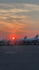 Sunset illuminates aircraft at Orio al Serio International Airport