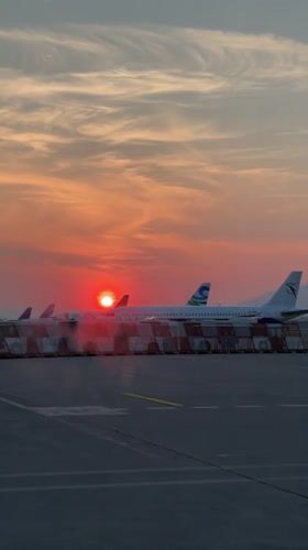 Sunset illuminates aircraft at Orio al Serio International Airport