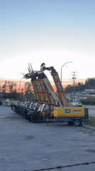 Yellow forklifts and generator trailer parked in Coquitlam lot