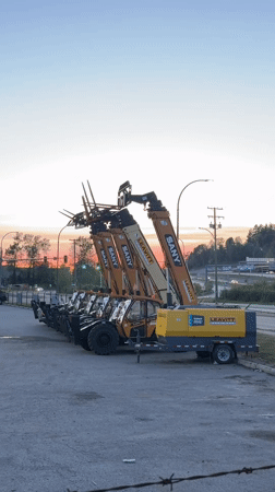 Yellow forklifts and generator trailer parked in Coquitlam lot