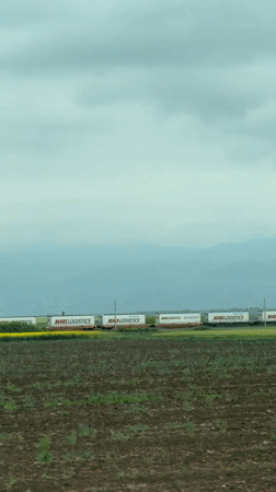 Mars Logistics freight train passes through Bulgarian farmland