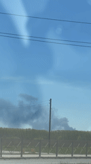 Smoke spotted rising behind treeline in Perm, Russia