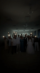 Wedding reception gathering captured with bride and guests