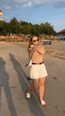 Woman visits farm animals, takes selfies in Montenegro coastal village
