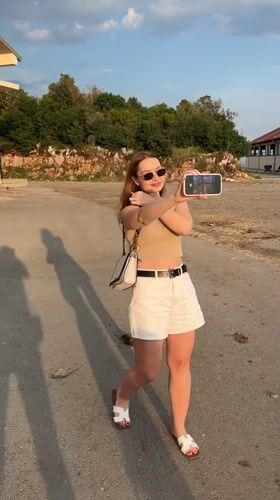Woman visits farm animals, takes selfies in Montenegro coastal village