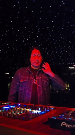 Late night in Encinitas: neon signs, a DJ set, and wet sidewalks