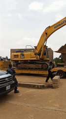 Excavator on trailer observed with civilian, officer in Durimi