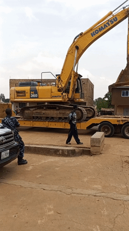 Excavator on trailer observed with civilian, officer in Durimi
