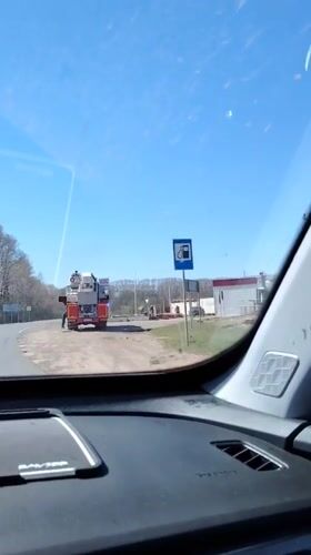 Fire truck stops on roadside in Rusalevka, Russia
