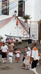 Traditional folk dance festival in a cobblestone town square