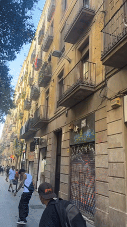 Ordinary Barcelona street life documented during sunny afternoon