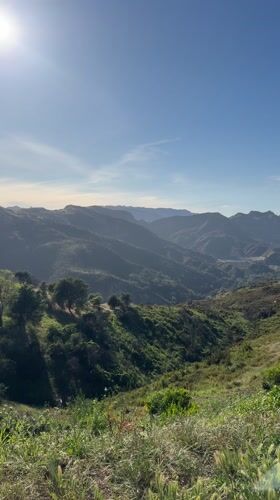 Clear skies over green Los Angeles mountains captured on video