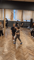Adults attend partner dance class in Saint Petersburg studio