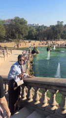 Weekend crowds enjoy Barcelona's Ciutadella Park fountain and dancing