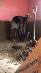 Workers renovate pink-walled room at New Stadium, Nigeria