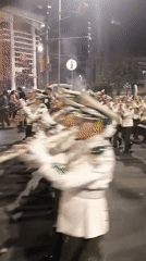Brass band marches through La Paz streets at night