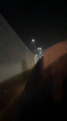 Evening traffic flows normally through Lahore roads and underpass